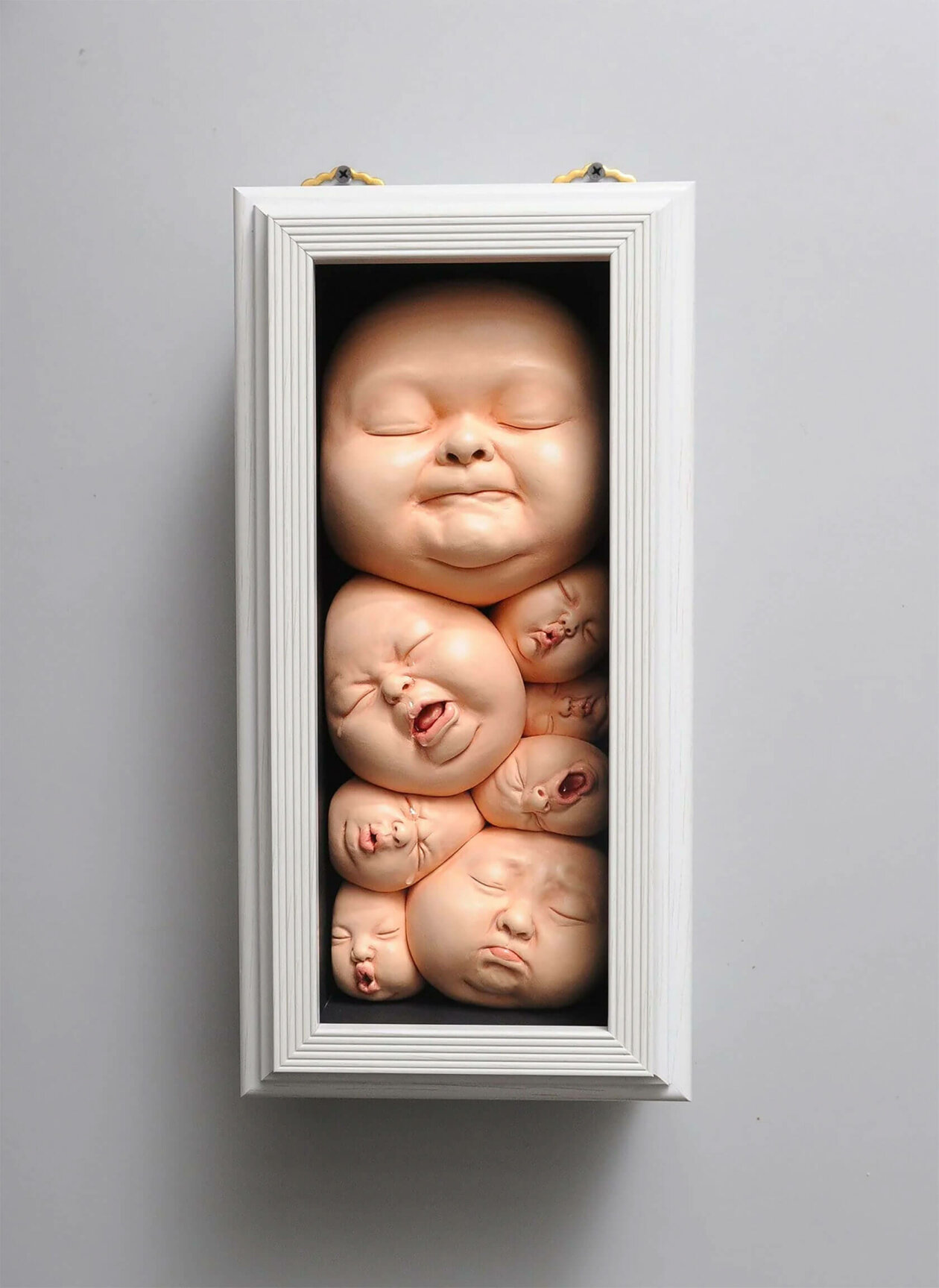 Distorted Baby Faces, Surreal Ceramic Sculptures By Johnson Tsang (26)